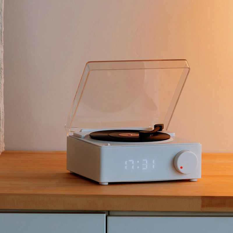 Vinyl record shaped speaker with time display