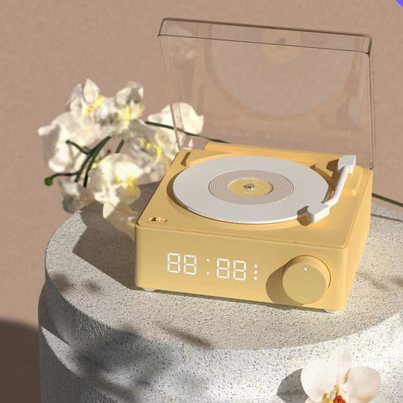 Vinyl record shaped speaker with time display