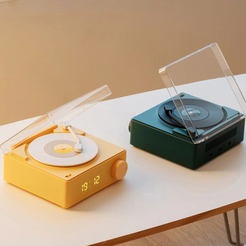 Vinyl record shaped speaker with time display