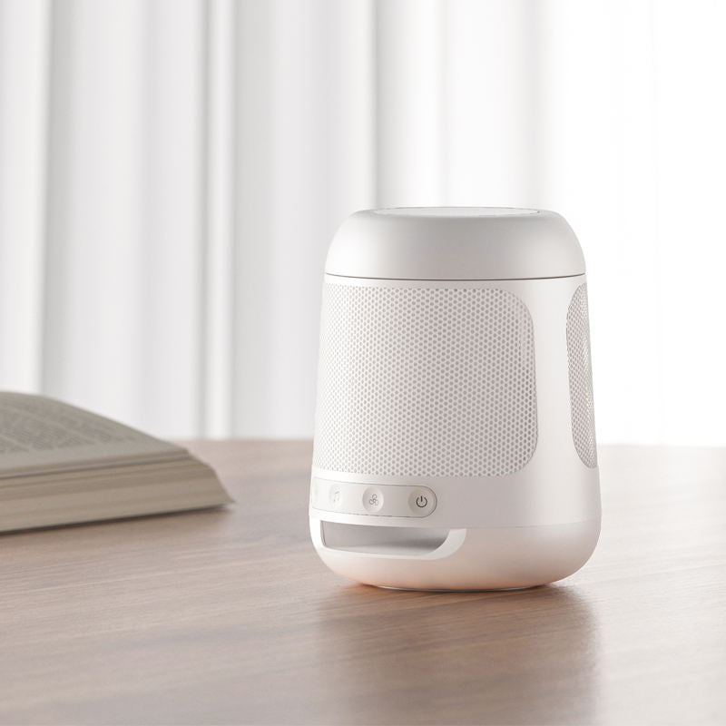 White noise sound machine with glow-in-the-dark speaker